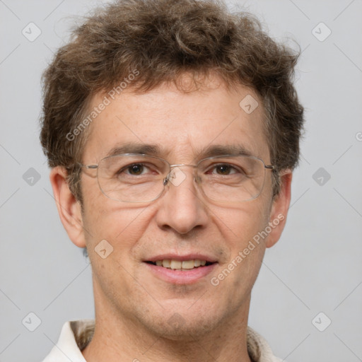 Joyful white adult male with short  brown hair and grey eyes