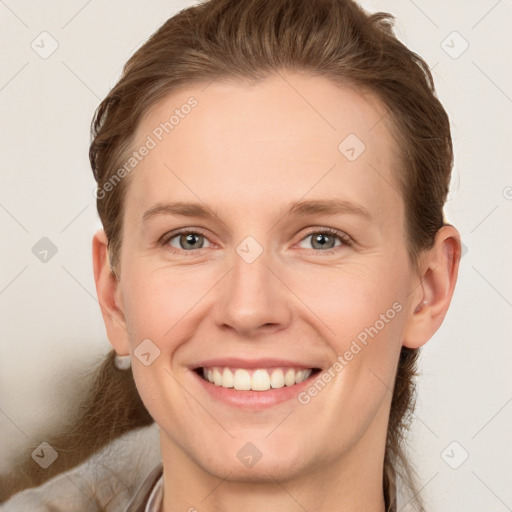 Joyful white young-adult female with short  brown hair and grey eyes