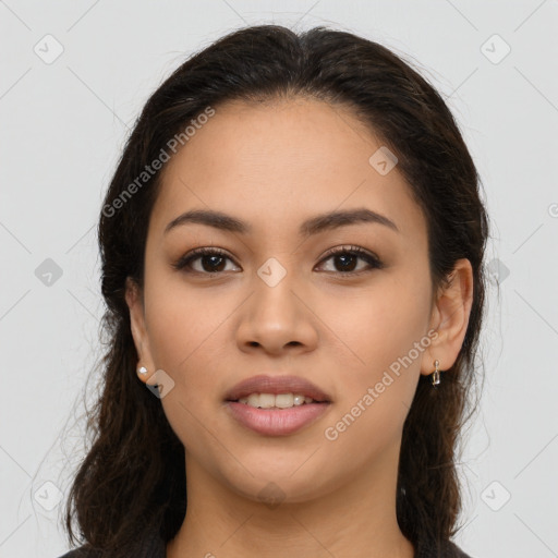 Joyful latino young-adult female with long  brown hair and brown eyes