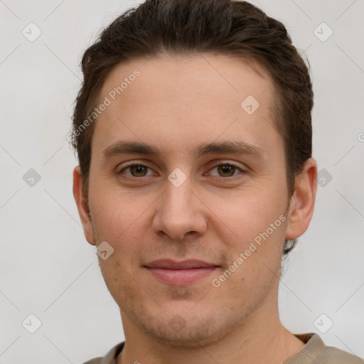 Joyful white young-adult male with short  brown hair and grey eyes