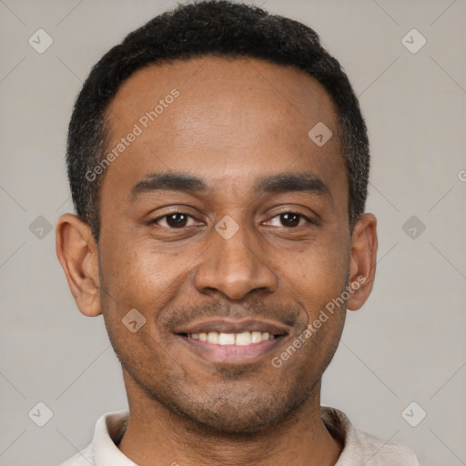 Joyful latino young-adult male with short  black hair and brown eyes