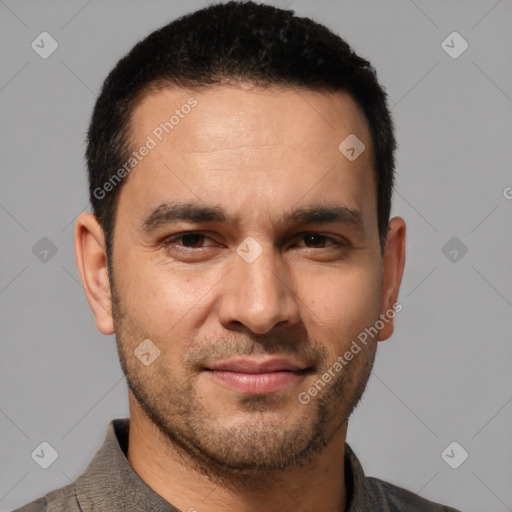 Joyful white young-adult male with short  black hair and brown eyes