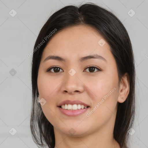 Joyful latino young-adult female with medium  brown hair and brown eyes