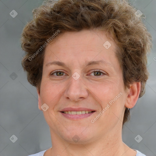 Joyful white adult female with short  brown hair and grey eyes