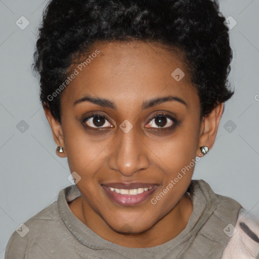 Joyful black young-adult female with short  brown hair and brown eyes