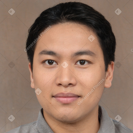 Joyful asian young-adult male with short  black hair and brown eyes