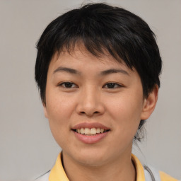 Joyful asian young-adult female with short  brown hair and brown eyes