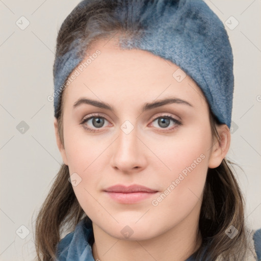 Neutral white young-adult female with medium  brown hair and grey eyes