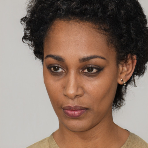 Neutral black young-adult female with short  black hair and brown eyes