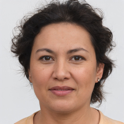 Joyful asian adult female with medium  brown hair and brown eyes
