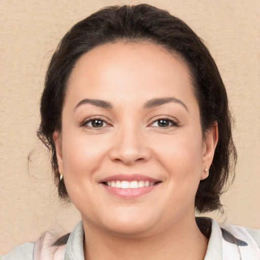 Joyful white young-adult female with medium  brown hair and brown eyes