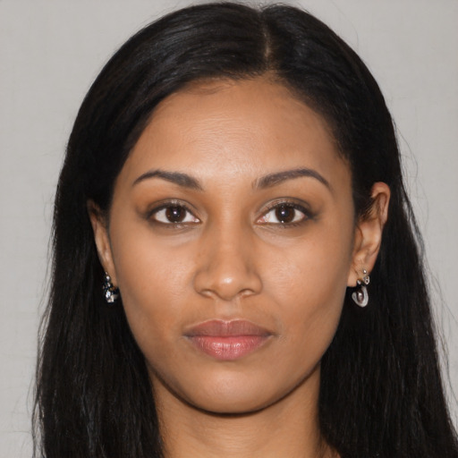 Joyful asian young-adult female with long  black hair and brown eyes