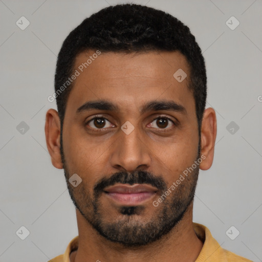 Joyful black young-adult male with short  black hair and brown eyes