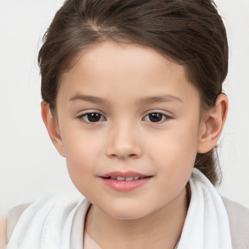 Joyful white child female with short  brown hair and brown eyes