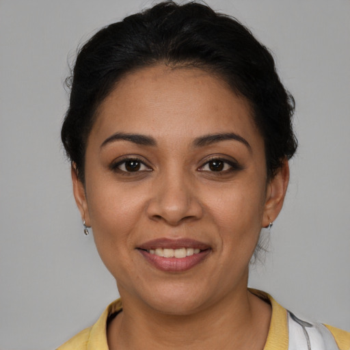 Joyful latino young-adult female with short  brown hair and brown eyes