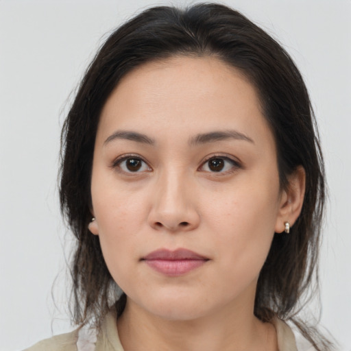 Joyful white young-adult female with medium  brown hair and brown eyes