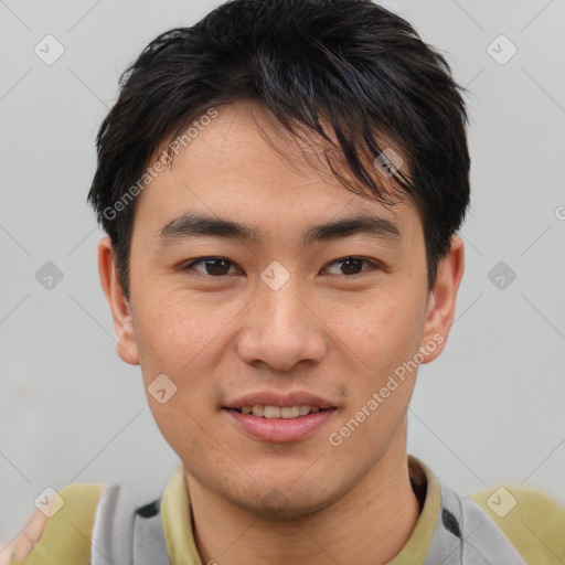 Joyful asian young-adult male with short  brown hair and brown eyes