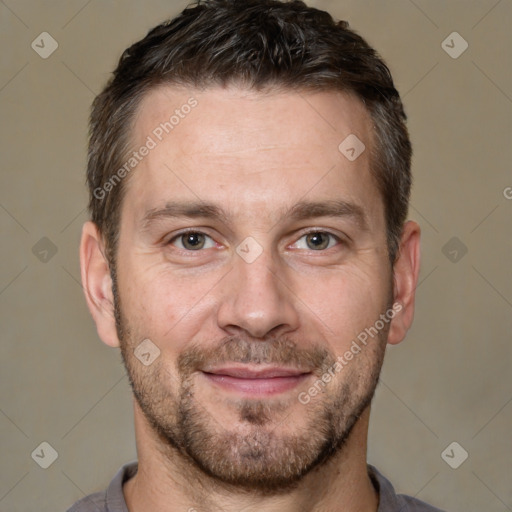 Joyful white adult male with short  brown hair and brown eyes