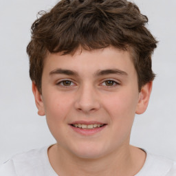 Joyful white child male with short  brown hair and brown eyes