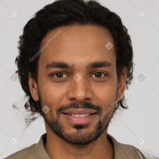 Joyful latino young-adult male with short  brown hair and brown eyes