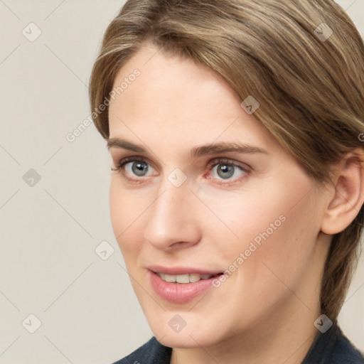 Joyful white young-adult female with medium  brown hair and grey eyes