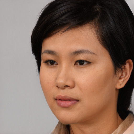 Neutral asian young-adult female with medium  black hair and brown eyes