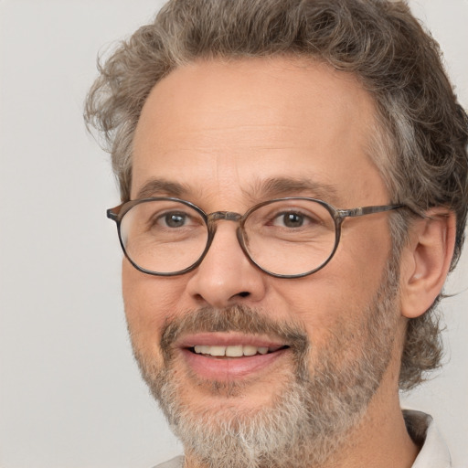 Joyful white middle-aged male with short  brown hair and brown eyes