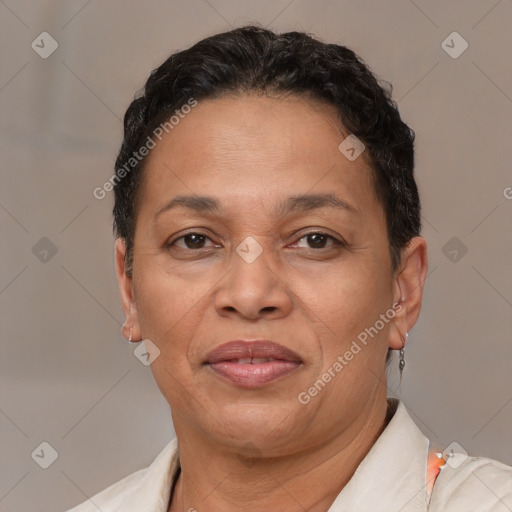 Joyful latino adult female with short  brown hair and brown eyes