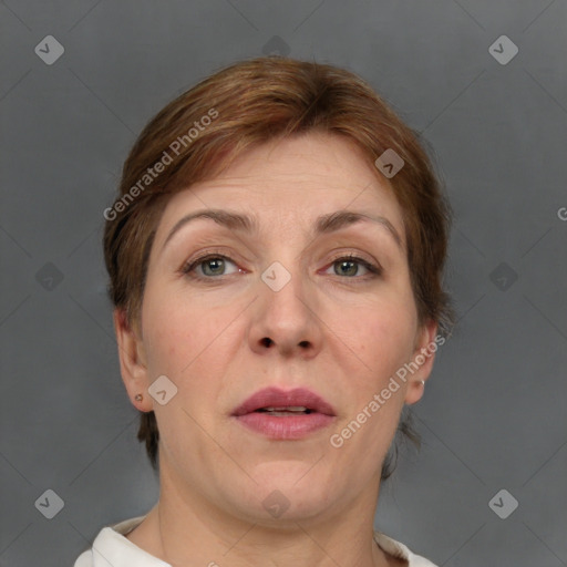 Joyful white adult female with short  brown hair and grey eyes