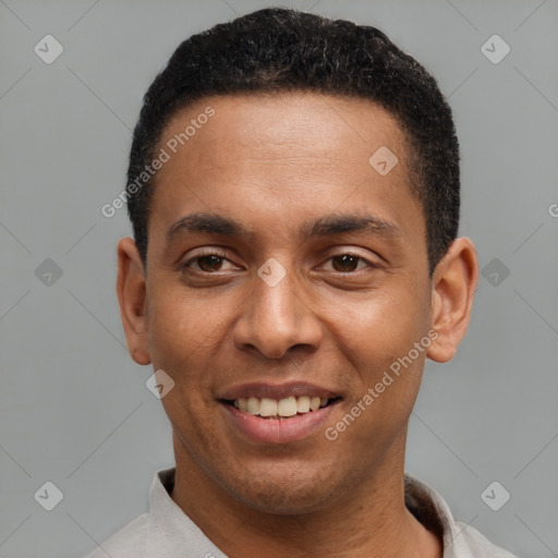 Joyful latino young-adult male with short  black hair and brown eyes