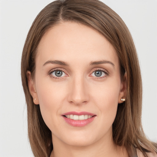 Joyful white young-adult female with long  brown hair and grey eyes