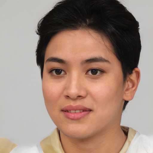 Joyful asian young-adult female with short  brown hair and brown eyes