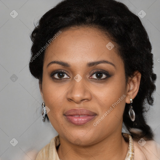 Joyful black young-adult female with long  black hair and brown eyes