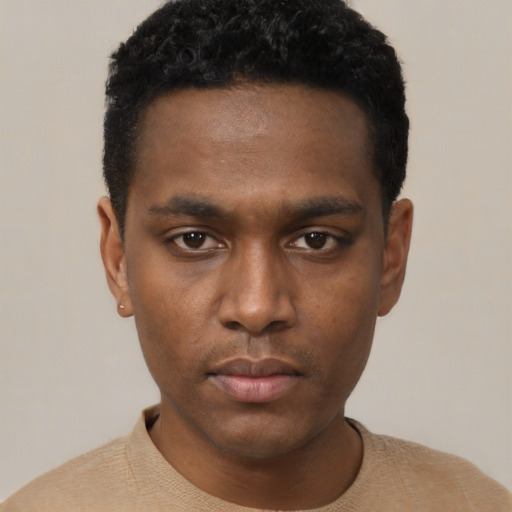 Neutral black young-adult male with short  black hair and brown eyes