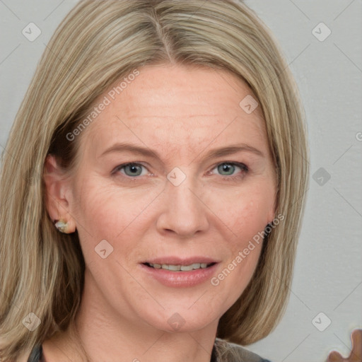 Joyful white adult female with medium  brown hair and blue eyes