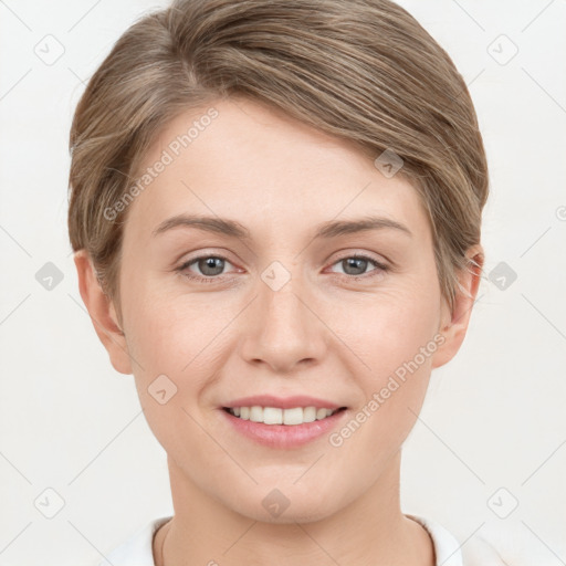 Joyful white young-adult female with short  brown hair and grey eyes