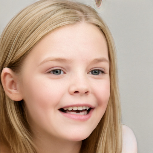 Joyful white child female with long  brown hair and blue eyes