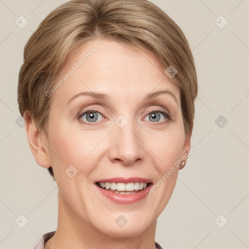 Joyful white adult female with short  brown hair and grey eyes