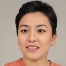 Joyful asian young-adult female with short  black hair and brown eyes