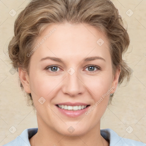 Joyful white young-adult female with medium  brown hair and blue eyes