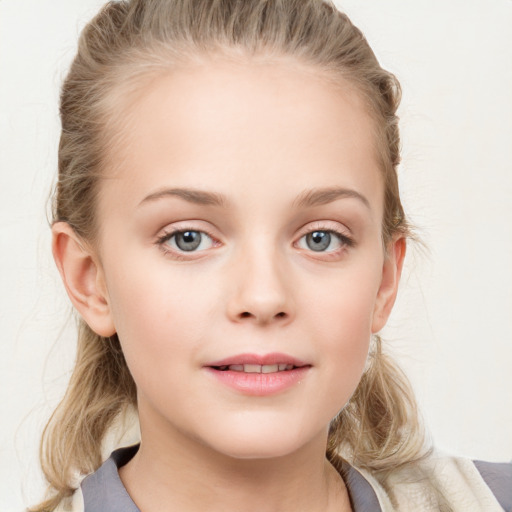 Joyful white child female with medium  brown hair and blue eyes