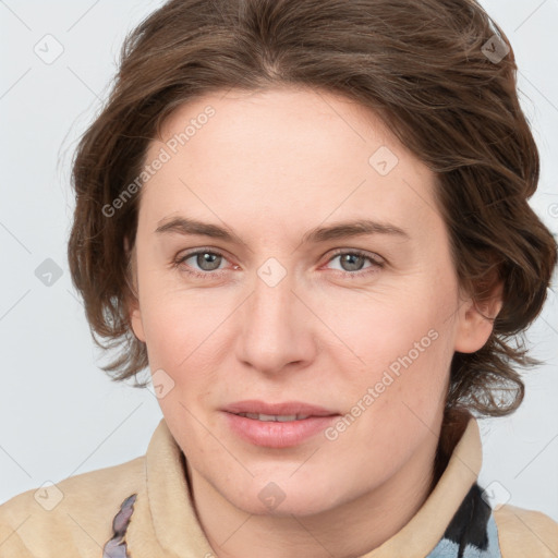 Joyful white young-adult female with medium  brown hair and blue eyes