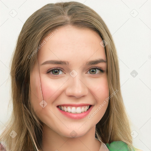 Joyful white young-adult female with long  brown hair and green eyes