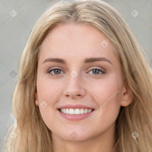 Joyful white young-adult female with long  brown hair and grey eyes