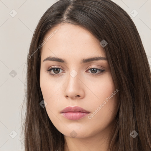 Neutral white young-adult female with long  brown hair and brown eyes