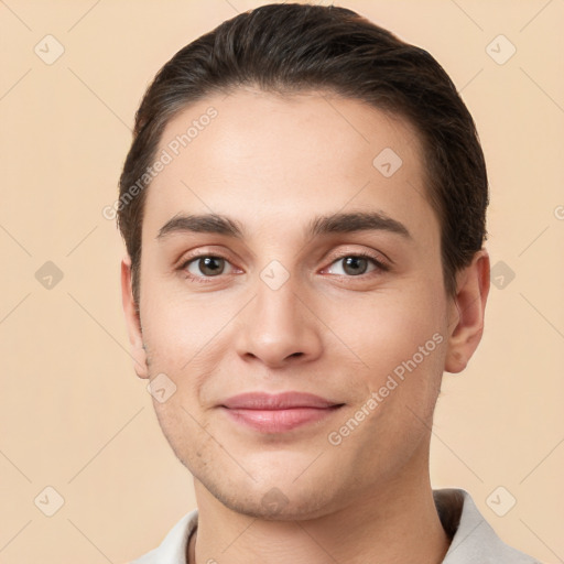 Joyful white young-adult male with short  brown hair and brown eyes