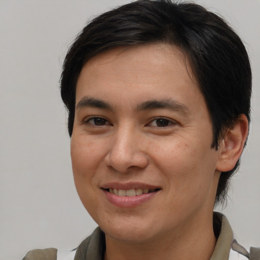 Joyful white young-adult male with medium  brown hair and brown eyes