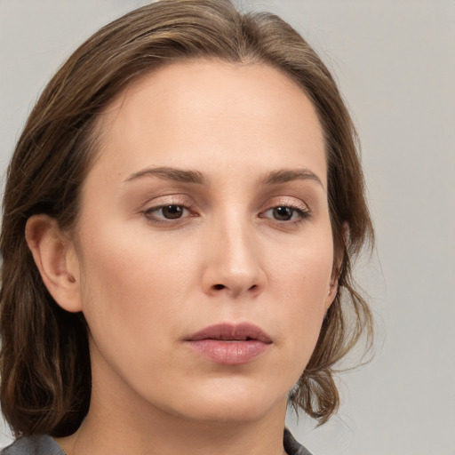 Neutral white young-adult female with medium  brown hair and grey eyes