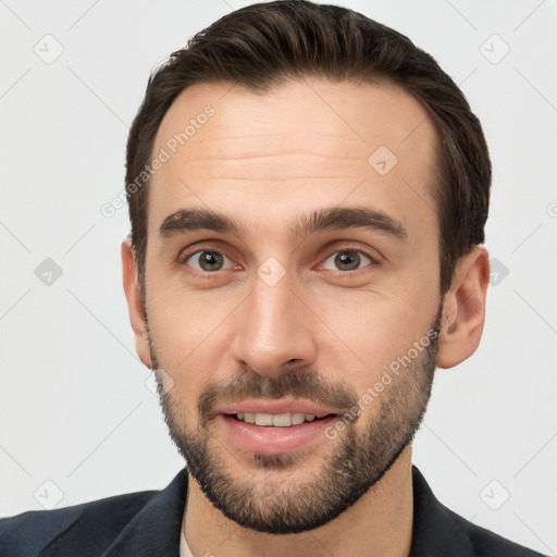 Joyful white young-adult male with short  brown hair and brown eyes