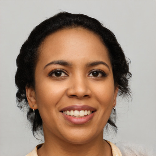 Joyful latino young-adult female with medium  black hair and brown eyes